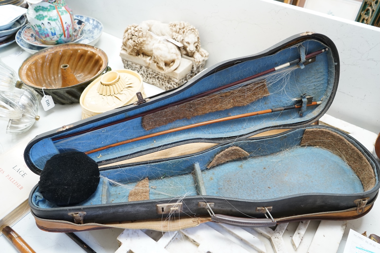 An early 20th century cased violin and cover, 60cm long
